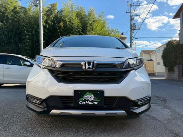 フリードハイブリッド ハイブリッド・クロスターホンダセンシング　純正ナビ　フルセグＴＶ　純正フリップダウンモニター　両側電動スライドドア　純正アルミホイール　バックモニター　ＥＴＣ（3枚目）