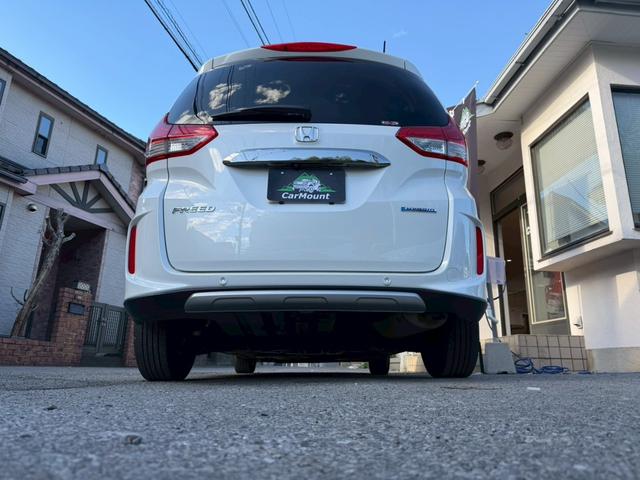 フリードハイブリッド ハイブリッド・クロスターホンダセンシング　純正ナビ　フルセグＴＶ　純正フリップダウンモニター　両側電動スライドドア　純正アルミホイール　バックモニター　ＥＴＣ（8枚目）