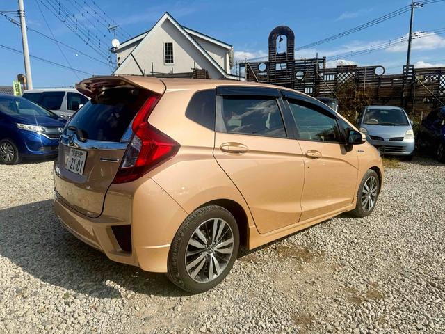 フィットハイブリッド Ｓパッケージ　ハイブリッド　ナビ　ＴＶ　オートクルーズコントロール　オートライト　ＬＥＤヘッドランプ　スマートキー　電動格納ミラー　ＡＴ　盗難防止システム　衝突安全ボディ　アルミホイール　ＡＢＳ　ＥＳＣ　エアコン（11枚目）