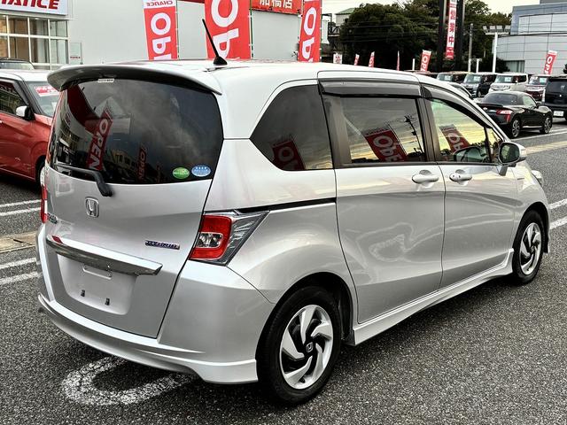 フリードハイブリッド ジャストセレクション　純正ナビゲーションシステム　ＢＬＵＥＴＯＯＴＨ　ＣＤ　ＤＶＤ　クルーズコントロール　両側電動スライドドア　バックカメラ　ステアリングリモコン　ＥＴＣ　スマートキー　パワーステアリング　パワーウインドウ（8枚目）