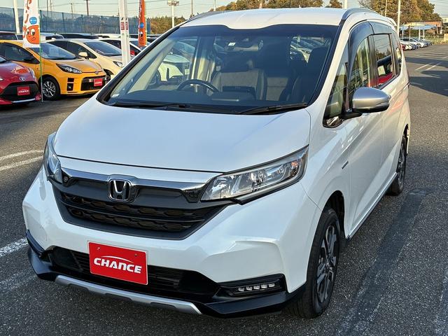 フリードハイブリッド ハイブリッド・クロスターホンダセンシング SDナビゲーションシステム フルセグテレビ BLUETOOTH バックカメラ スマートキー プッシュスタート ETC クルーズコントロール 前席シートヒーター 両側電動スライドドア LEDヘッドライト(5枚目)