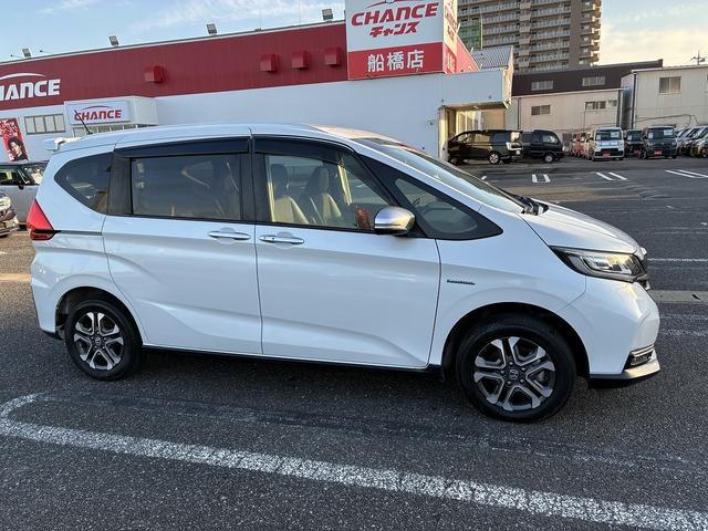 フリードハイブリッド ハイブリッド・クロスターホンダセンシング SDナビゲーションシステム フルセグテレビ BLUETOOTH バックカメラ スマートキー プッシュスタート ETC クルーズコントロール 前席シートヒーター 両側電動スライドドア LEDヘッドライト(8枚目)