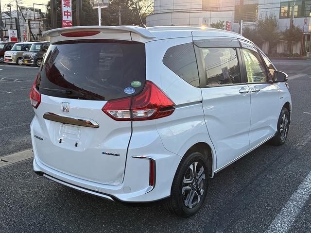 フリードハイブリッド ハイブリッド・クロスターホンダセンシング SDナビゲーションシステム フルセグテレビ BLUETOOTH バックカメラ スマートキー プッシュスタート ETC クルーズコントロール 前席シートヒーター 両側電動スライドドア LEDヘッドライト(9枚目)