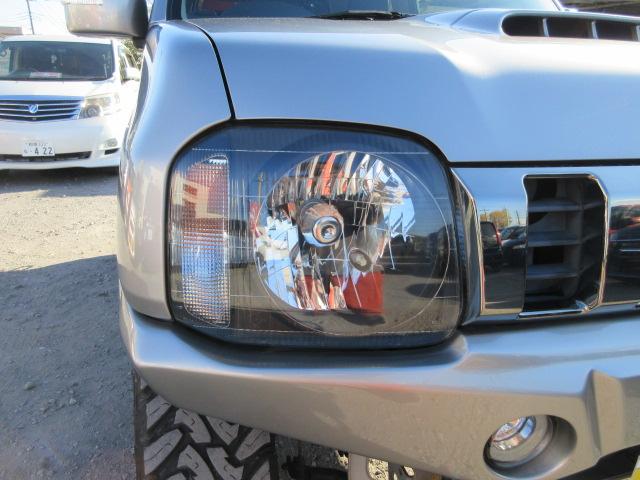 ジムニー ランドベンチャー　最終１０型　５ＭＴ　タニグチマフラー　ＲＡＹＳ１６インチアルミホイールＴＯＹＯオープンカントリーマッドタイヤ２２５／７５　２インチリフトアップ　前後ハーフバンパー　ガラスフィルム貼　ＭＯＭＯステア（48枚目）