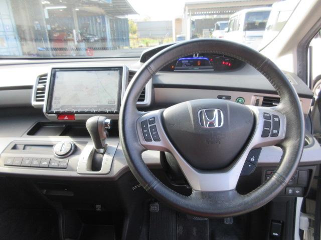 フリードハイブリッド ジャストセレクション　車検２年付き　大画面メモリナビ　フルセグＴＶ　バックカメラ　ＥＴＣ　ハーフレザーシート　両側電動スライドドア　クルーズコントロール　純正１５インチアルミホイール（27枚目）