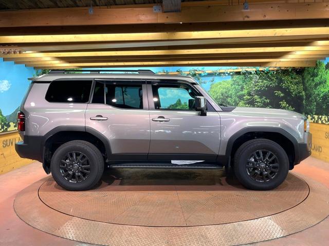 ランドクルーザー250 VX 禁煙車 7人乗り サンルーフ 純正12型ナビ 全周囲カメラ JBLサウンド デジタルインナーミラー ブラインドスポットモニター レーダークルーズ 電動リアゲート 黒側 シートベンチレーション ETC(63枚目)