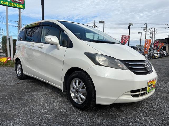 フリード G ジャストセレクション 平成22年式 走行距離69000キロ ナビ ワンセグTV スマートキー ETC 両側電動スライドドア 純正アルミ 3列シート7人乗り HIDヘッドライト 修復歴無し(5枚目)