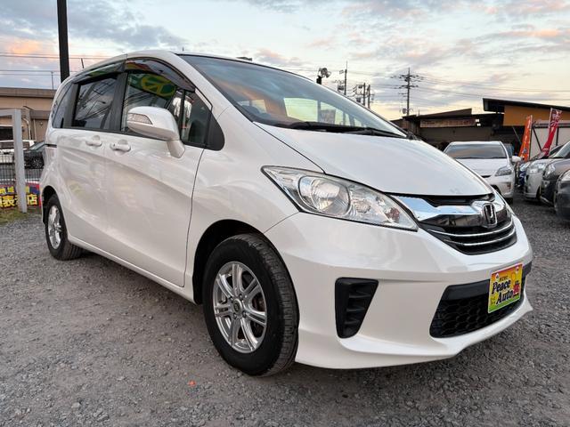 フリード Ｇ　ジャストセレクション　平成２７年式　走行距離５７０００キロ　ナビ　バックカメラ　ワンセグＴＶ　両側電動スライドドア　Ｂｌｕｅｔｏｏｔｈオーディオ　ＥＴＣ　スマートキー　社外アルミ　３列シート６人乗り（5枚目）