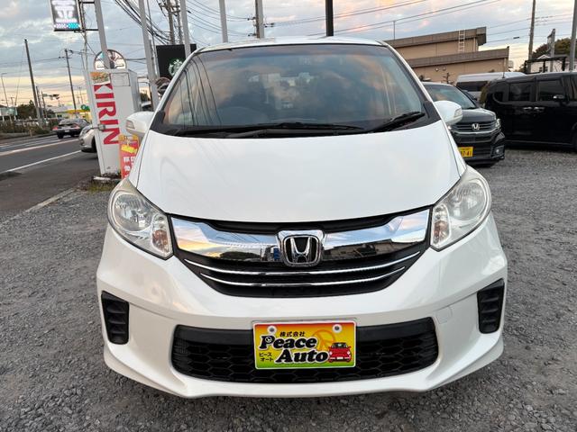 フリード Ｇ　ジャストセレクション　平成２７年式　走行距離５７０００キロ　ナビ　バックカメラ　ワンセグＴＶ　両側電動スライドドア　Ｂｌｕｅｔｏｏｔｈオーディオ　ＥＴＣ　スマートキー　社外アルミ　３列シート６人乗り（6枚目）