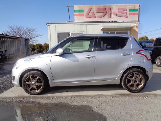 スイフト ＸＧ　５速マニュアル車　柿本改マフラー　社外１６インチアルミ　ＣＤデッキ　ビルトインＥＴＣ　プライバシーガラス　ドアバイザー　プッシュスタート　スマートキー　イモビ／セキュリティ　電格ミラー　オートエアコン（7枚目）