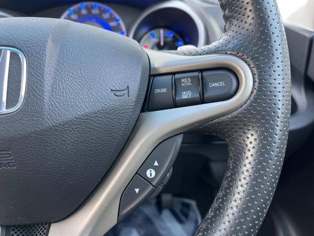 フィットハイブリッド ナビプレミアムセレクション 純正HDDナビ バックカメラ 禁煙車 スマートキー HIDヘッド ビルトインETC 純正15インチアルミ オートライト オートエアコン CD 地デジ パドルシフト(6枚目)