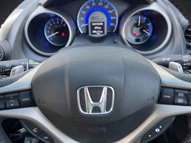 フィットハイブリッド ナビプレミアムセレクション 純正HDDナビ バックカメラ 禁煙車 スマートキー HIDヘッド ビルトインETC 純正15インチアルミ オートライト オートエアコン CD 地デジ パドルシフト(38枚目)