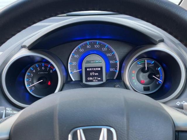 フィットハイブリッド ナビプレミアムセレクション 純正HDDナビ バックカメラ 禁煙車 スマートキー HIDヘッド ビルトインETC 純正15インチアルミ オートライト オートエアコン CD 地デジ パドルシフト(55枚目)