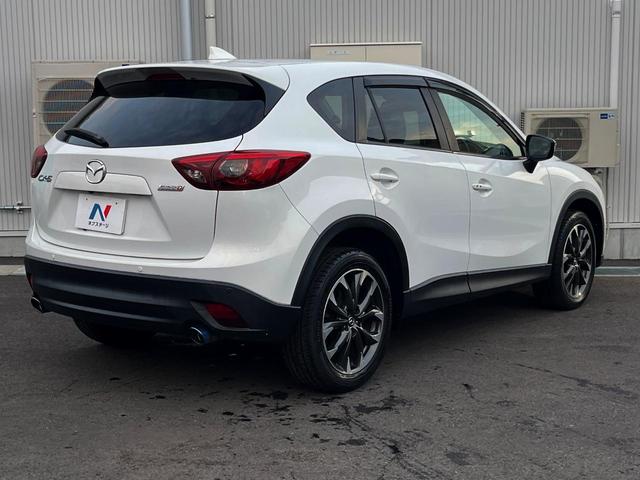 ＣＸ－５ ＸＤ　Ｌパッケージ　ディーゼル（軽油）　バックカメラ　ＢＯＳＥサウンド　レーダークルーズ　レザーシート　コーナーセンサー　スマートキー　ＨＩＤヘッド　ＥＴＣ　純正１９インチアルミ　オートハイビーム　オートライト（22枚目）