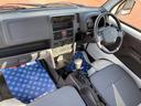 キャリイトラック KCエアコンパワステ 4型 2WD 3AT ラジオプレーヤー ワンオーナー スピーカー内蔵AM・FMラジオプレーヤー ドアバイザー スペアタイヤ 中古車画像_4