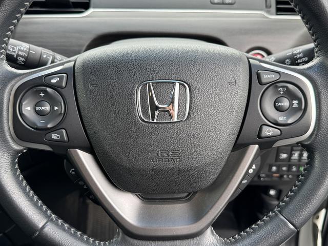 フリードハイブリッド ハイブリッド・Ｇホンダセンシング　１オーナー・ホンダセンシング・両側パワースライド・フルセグナビ・ＥＴＣ・バックカメラ・ＢＴオーディオ・ＬＥＤヘッドライト・ＡＵＴＯライト・スマートキー・純正１５ＡＷ・革ステア・ドアバイザー（11枚目）