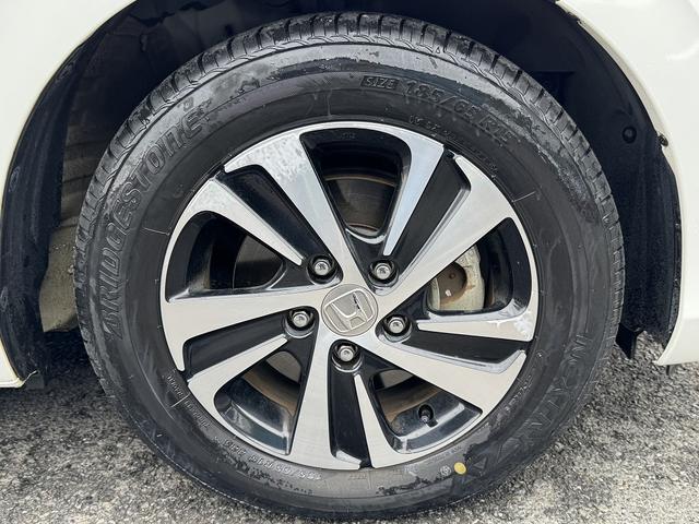 フリードハイブリッド ハイブリッド・Ｇホンダセンシング　１オーナー・ホンダセンシング・両側パワースライド・フルセグナビ・ＥＴＣ・バックカメラ・ＢＴオーディオ・ＬＥＤヘッドライト・ＡＵＴＯライト・スマートキー・純正１５ＡＷ・革ステア・ドアバイザー（52枚目）