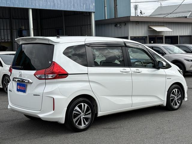 フリードハイブリッド ハイブリッド・EX 両Pスライド・Rモニター・フルセグ9inナビ・Bカメラ・BTオーディオ・LEDライト・ACC・LKA・シートヒーター・ドアバイザー・プライバシーガラス・本革ステア・ETC・15AW・オートライト(42枚目)