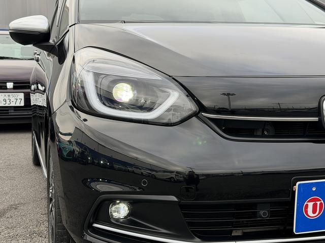 フィット ｅ：ＨＥＶリュクス　フルセグナビ・Ｓ＆Ｂカメラ・ＢＴオーディオ・ＬＥＤライト・ＡＣＣ・ＬＫＡ・ＡＨＢ・Ｃソナー・ハーフレザー・本革ステア・ミラーウィンカー・ドアバイザー・ＥＴＣ２．０・スマキー・１６ＡＷ（41枚目）