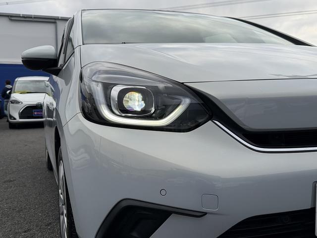 フィット ｅ：ＨＥＶホーム　ホンダＳ・フルセグナビ・Ｂカメラ・ＢＴオーディオ・ＬＥＤライト・ＡＣＣ・ＬＫＡ・ＡＨＢ・Ｃソナー・ＥＴＣ・ハーフレザー・本革ステア・ミラーウィンカー・ＵＳＢ・ドアバイザー・プライバシーガラス・記録簿（29枚目）