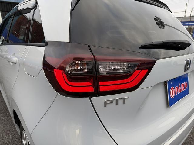 フィット ｅ：ＨＥＶホーム　ホンダＳ・フルセグナビ・Ｂカメラ・ＢＴオーディオ・ＬＥＤライト・ＡＣＣ・ＬＫＡ・ＡＨＢ・Ｃソナー・ＥＴＣ・ハーフレザー・本革ステア・ミラーウィンカー・ＵＳＢ・ドアバイザー・プライバシーガラス・記録簿（31枚目）