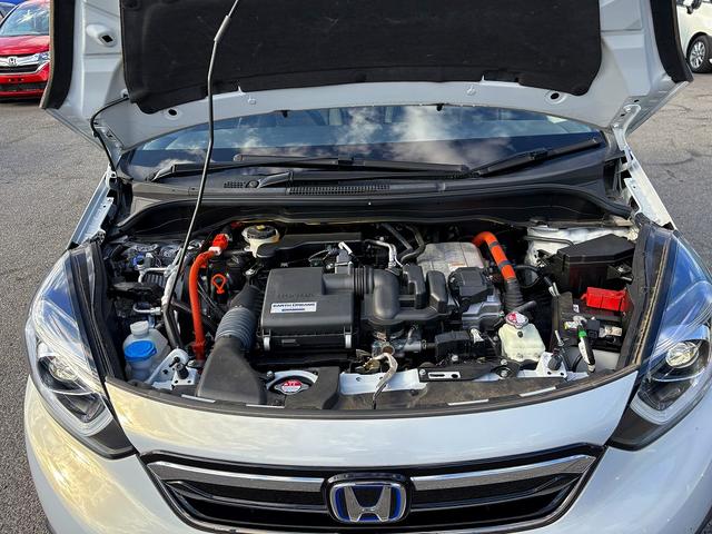 フィット e:HEVホーム ホンダセンシング・純正ナビ・バックカメラ・ETC・CD・BTオーディオ・USB・LEDヘッドライト・AUTOハイビーム・Cソナー・革ステア・ハーフレザー・フロアマット・ドアバイザー(19枚目)