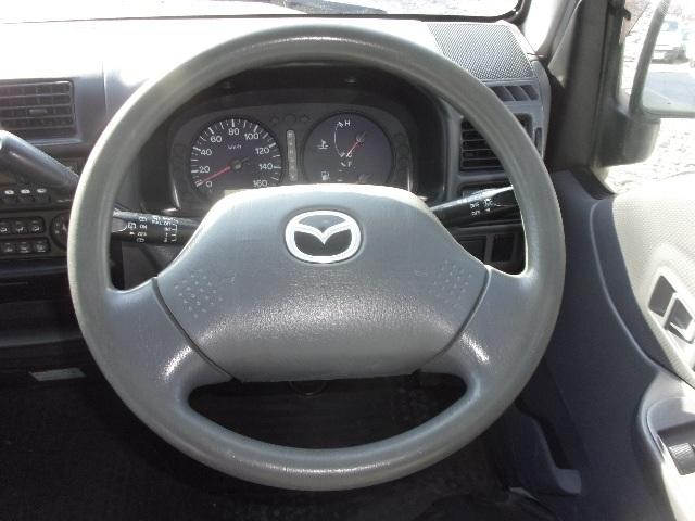 ブローニィバン ロングＤＸ　平床　リアＷタイヤ　ＡＴ　前後バンパーラプター塗装　５ドア　３人乗り　６人乗り構造変更可能　プライバシーガラス　ＡＣ　エアバック　ＰＳ　ＰＷ　集中ドアロック　積載１２５０ｋｇ（26枚目）