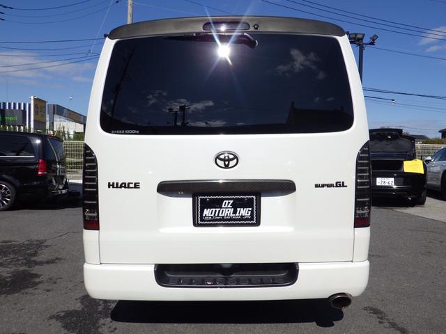 ハイエースバン スーパーGL ダークプライム Bluetooth対応ALPINEナビ/フリップダウンモニター ベッドキット バッドフェイス 玄武ローダウン エムテクノ減衰力調整式ショック MTS17インチアルミ OBD診断済み グー鑑定書付き(10枚目)