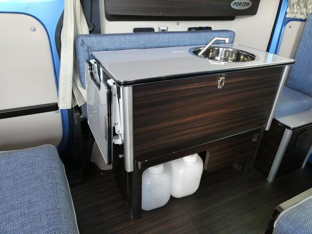 ＮＶ２００バネットバン 　キャンピングカー広島製　ポップ・コン　ポップアップルーフ・サブバッテリー・ＦＦヒーター・走行充電・外部入力電源・インバーター・シンク・コンロ・テーブル・ＳＤナビＢカメラ・ＰＯＰ．ＣＯＭ　キャンパーＲ（24枚目）