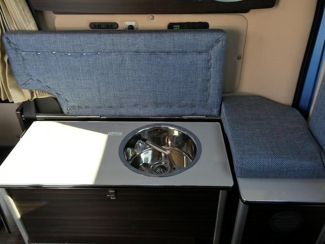 ＮＶ２００バネットバン 　キャンピングカー広島製　ポップ・コン　ポップアップルーフ・サブバッテリー・ＦＦヒーター・走行充電・外部入力電源・インバーター・シンク・コンロ・テーブル・ＳＤナビＢカメラ・ＰＯＰ．ＣＯＭ　キャンパーＲ（27枚目）