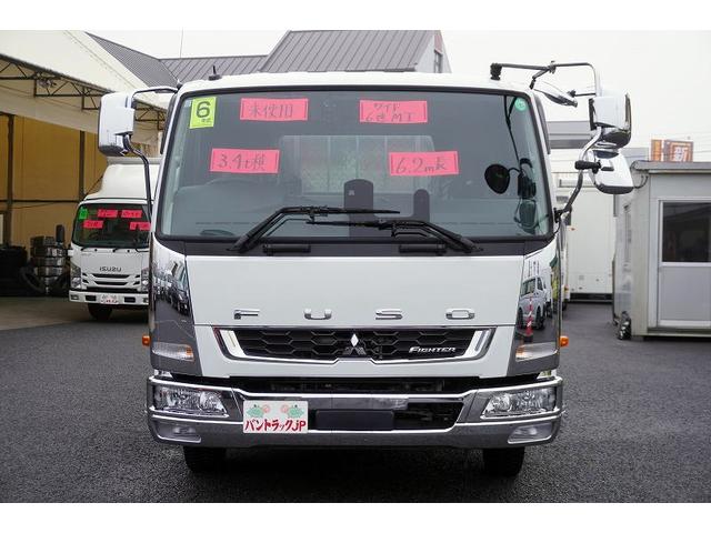 ファイター ４トン　ワイド　平ボディー　アルミブロック　リアエアサス　ベッド付　積載３４００ｋｇ　６．２ｍ長　五方開　東洋ボディー製造りボディー　アオリ上部プロテクター付　鳥居シマ板張り　落込フック　バックカメラ　ＥＴＣ　坂道発進補助　メッキ　アルミホイール　融雪仕様（8枚目）
