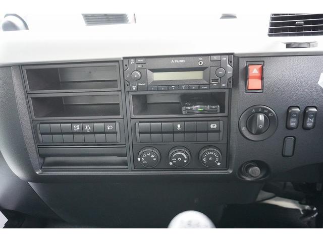 ファイター ４トン　ワイド　平ボディー　アルミブロック　リアエアサス　ベッド付　積載３４００ｋｇ　６．２ｍ長　五方開　東洋ボディー製造りボディー　アオリ上部プロテクター付　鳥居シマ板張り　落込フック　バックカメラ　ＥＴＣ　坂道発進補助　メッキ　アルミホイール　融雪仕様（22枚目）