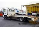 フォワード 増トン　ベッド付　重機運搬車　本所ボディー製　８．８トン積　標準幅　積載８８００ｋｇ　アユミ板掛け　アユミ板付き　鳥居Ｊフック　鳥居下部鉄板張り　鳥居ラダー　スタンション穴　網工具入れ　ＬＥＤ作業灯　ＥＴＣ　坂道発進補助　６速ＭＴ　回送（7枚目）