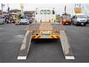 増トン　ベッド付　重機運搬車　本所ボディー製　８．８トン積　標準幅　積載８８００ｋｇ　アユミ板掛け　アユミ板付き　鳥居Ｊフック　鳥居下部鉄板張り　鳥居ラダー　スタンション穴　網工具入れ　ＬＥＤ作業灯　ＥＴＣ　坂道発進補助　６速ＭＴ　回送（41枚目）