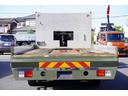 ヒノレンジャー 4トン ワイド ベッド付 重機運搬車 ウインチ ラジコン タダノ製ハイジャッキ 造りボディー 積載2050kg アユミ板掛け アルミブロック 鳥居シマ板張り 作業灯 坂道発進補助 衝突軽減ブレーキ 車線逸脱警報 6速MT セルフローダー 回送 寝台 ETC(5枚目)