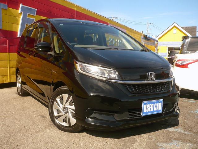 フリードハイブリッド ハイブリッド・Ｇホンダセンシング　社外メモリーナビ　地ＤＴＶ　Ｂカメラ　ＣＤ録＆ＤＶＤ　Ｂｌｕｅｔｏｏｔｈ電話＆音楽　ＥＴＣ　スマートキー　前席Ｓヒーター　フリップダウンモニター　両側自動ドア　レーダークルコン　ＬＥＤライト　衝突軽減（2枚目）