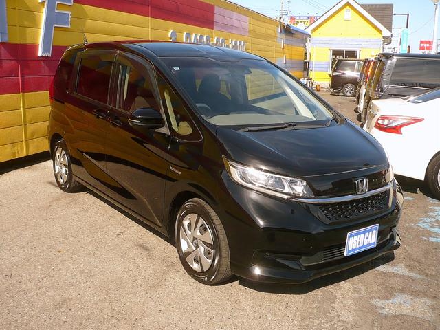 フリードハイブリッド ハイブリッド・Ｇホンダセンシング　社外メモリーナビ　地ＤＴＶ　Ｂカメラ　ＣＤ録＆ＤＶＤ　Ｂｌｕｅｔｏｏｔｈ電話＆音楽　ＥＴＣ　スマートキー　前席Ｓヒーター　フリップダウンモニター　両側自動ドア　レーダークルコン　ＬＥＤライト　衝突軽減（3枚目）