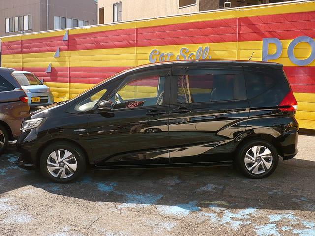 フリードハイブリッド ハイブリッド・Ｇホンダセンシング　社外メモリーナビ　地ＤＴＶ　Ｂカメラ　ＣＤ録＆ＤＶＤ　Ｂｌｕｅｔｏｏｔｈ電話＆音楽　ＥＴＣ　スマートキー　前席Ｓヒーター　フリップダウンモニター　両側自動ドア　レーダークルコン　ＬＥＤライト　衝突軽減（14枚目）