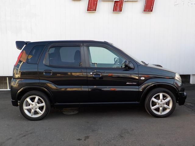 Keiワークス ベースグレード 5速マニュアル 4WD ターボ 社外HDDナビ シートヒーター 純正レカロシート 純正アルミ 純正エアロ ルーフスポイラー ワンセグTV 革巻きステア フォグライト ドアバイザー キーレス 電格ミラー(6枚目)