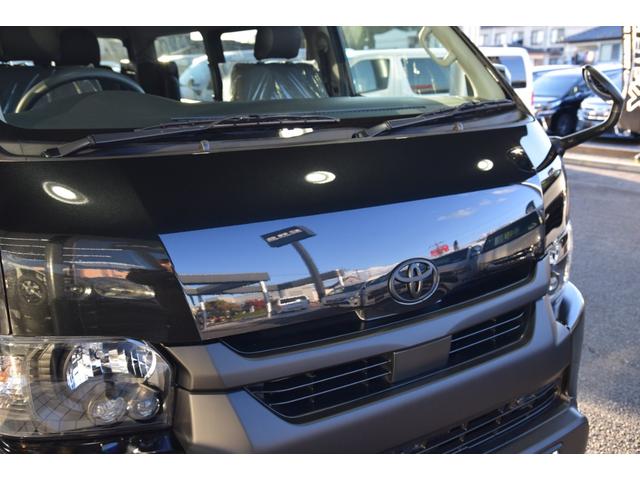 ハイエースワゴン GL 千葉BLACKSTYLE フロントバンパーガード ESSEX16インチアルミ 25mmオーバーフェンダー フローティングナビ 12.8型後席モニター 天井スピーカー デジタルインナーミラー(52枚目)