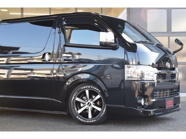 ハイエースバン スーパーGL ダークプライムII ローダウン ベッドキット 車中泊 フロントスポイラー ESSEX17インチアルミ フローティングナビ 10.1型後席モニター LEDヘッドライト LEDテールランプ バックカメラ付き防眩ミラー(8枚目)