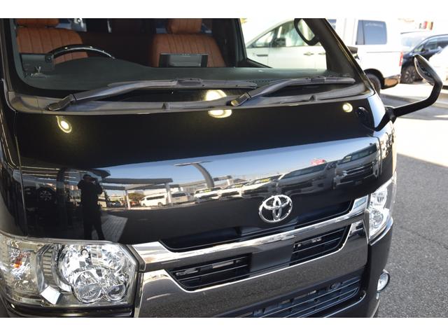 ハイエースバン スーパーGL ダークプライムII ローダウン ベッドキット 車中泊 フロントスポイラー ESSEX17インチアルミ フローティングナビ 10.1型後席モニター LEDヘッドライト LEDテールランプ バックカメラ付き防眩ミラー(54枚目)