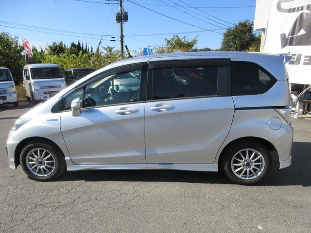 フリードハイブリッド ジャストセレクション　外アルミホイール　フリップダウンモニター　９インチナビ　スマートキー２個　バックカメラ　片側電動パワースライドドア　ＨＩＤヘッドライト　クルーズコントロール　アイドリングストップ　ＡＢＳ（14枚目）