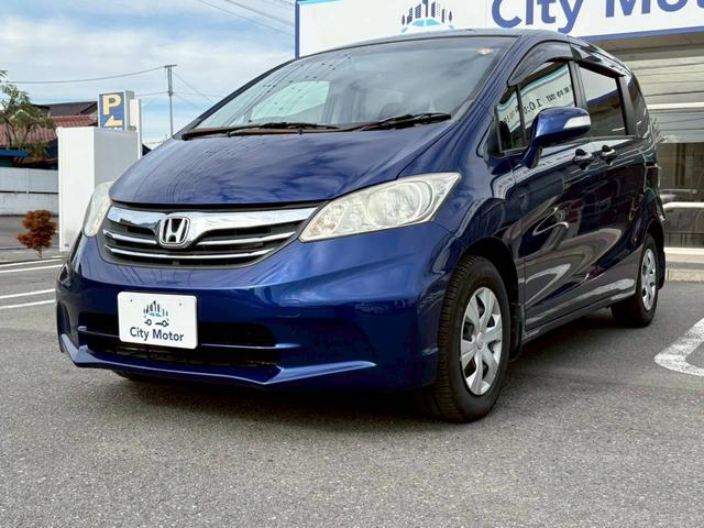 フリード GH 電動スライドドア ナビ TV ETC バックモニター ヘッドライトHID オートライト スマートキー オートエアコン 電動格納ミラー サイドバイザー パワーウィンドウ VSA 純正ホイールキャップ(7枚目)