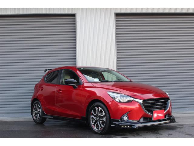 デミオ ＸＤツーリング　Ｌパッケージ　１オーナー　ＡｕｔｏＥｘｅエアロ／グリル／マフラー／ボンネットダンパー　純正ナビ　フルセグＴＶ　バックカメラ　ドライブレコーダー　ＬＥＤヘッドライト／フォグ　スマートキー　ＥＴＣ　ＵＳＢ接続（2枚目）