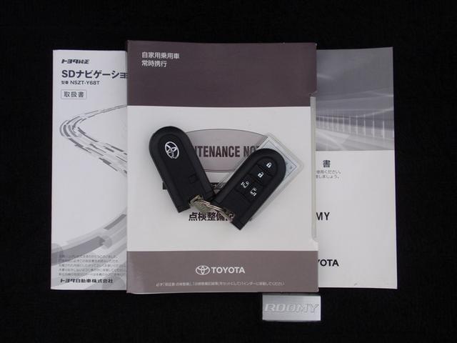 ルーミー カスタムＧ－Ｔ　助手席エアバック　点検記録簿　アルミホイール　ナビ＆ＴＶ　エアバッグ　オートエアコン　ＡＢＳ　パワーウィンドウ　パワステ　メモリーナビ　バックビューモニター　フルセグ地デジＴＶ（18枚目）