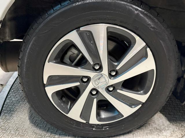 フリードハイブリッド ハイブリッド・Ｇホンダセンシング　Ｓパッケージ、Ｃパッケージ、純正メモリーナビ、ＥＴＣ車載器、アダプティブクルーズコントロール、純正フロントドライブレコーダー、バックカメラ、純正アルミホイール、　フロントカメラ　軽減ブレーキ　記録簿（19枚目）