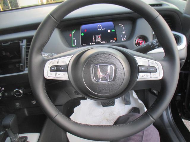 フィット e:HEVホーム 当社登録済未使用車 ナビ装着用スペシャルパッケージ フルオートエアコン LEDヘッドライト ホンダセンシング スマートキー 前後誤発進抑制機能 助手席エアバッグ 運転席エアバッグ 1オナ 禁煙 ABS(8枚目)