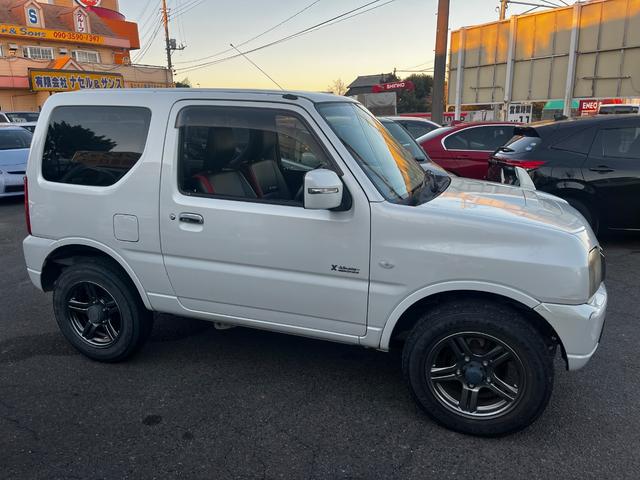 ジムニー クロスアドベンチャー パワーステアリング パワーウィンドウ エアバッグ エアコン キーレス 4WD ターボ ETC フォグランプ 社外AW(4枚目)