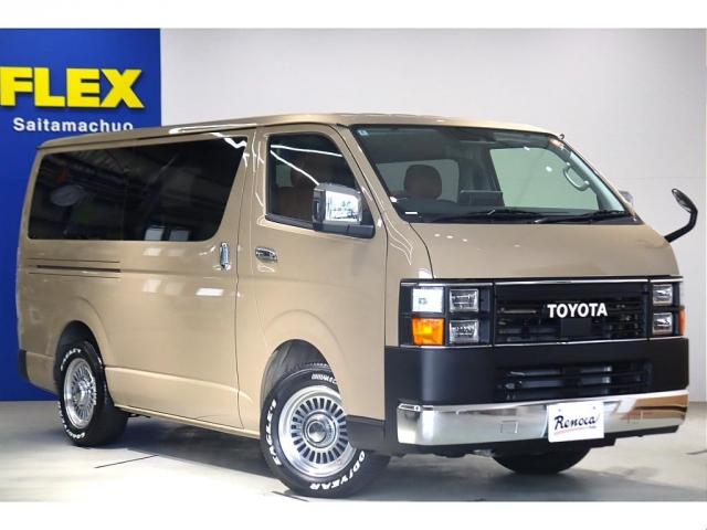 ハイエースバン ロングスーパーGL アースカラーパッケージ ベージュ ガソリン2WD 角目フェイス クラシックテール カリフォルニア16インチAW ナスカータイヤ アルパインナビ 茶木目インパネ ベッドキット シートカバー ETCPVM(4枚目)